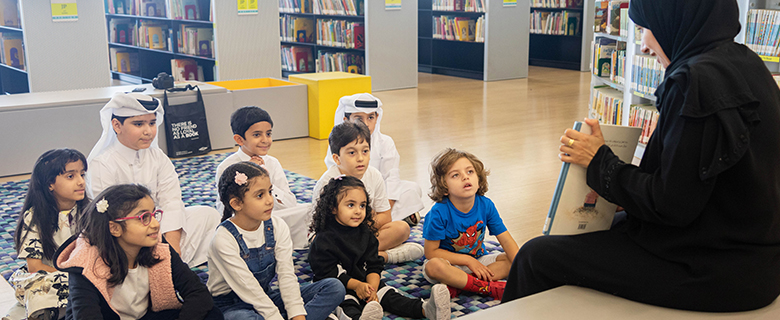 children listening to stories at the QNL Children's Library