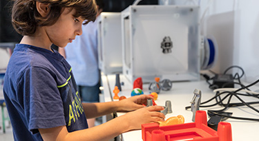 boy printing 3D object