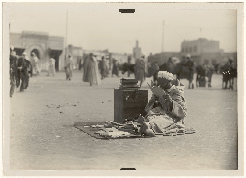 Old Moroccan man reading a book